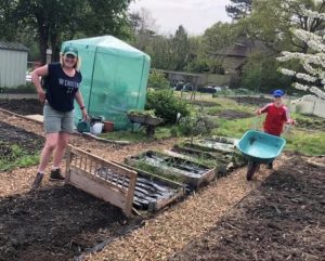 Helen and one of her sons on her allotment